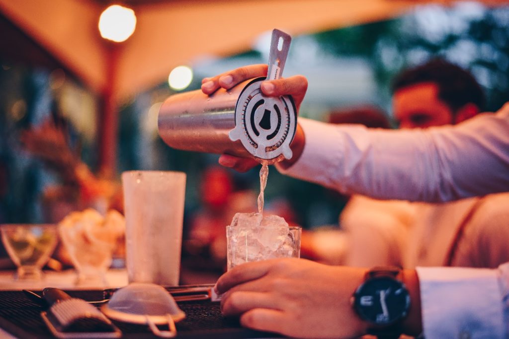 image of a waiter making drink