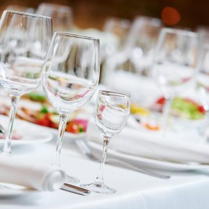 Catering services. glasses set and dish with food meal in restaurant